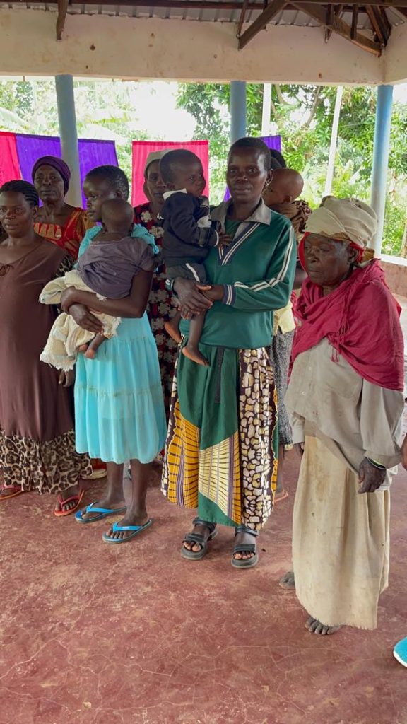 Projects 3 Women and children receiving support at a community distribution